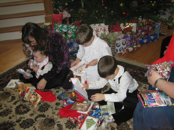 Boys looking intently at their gifts